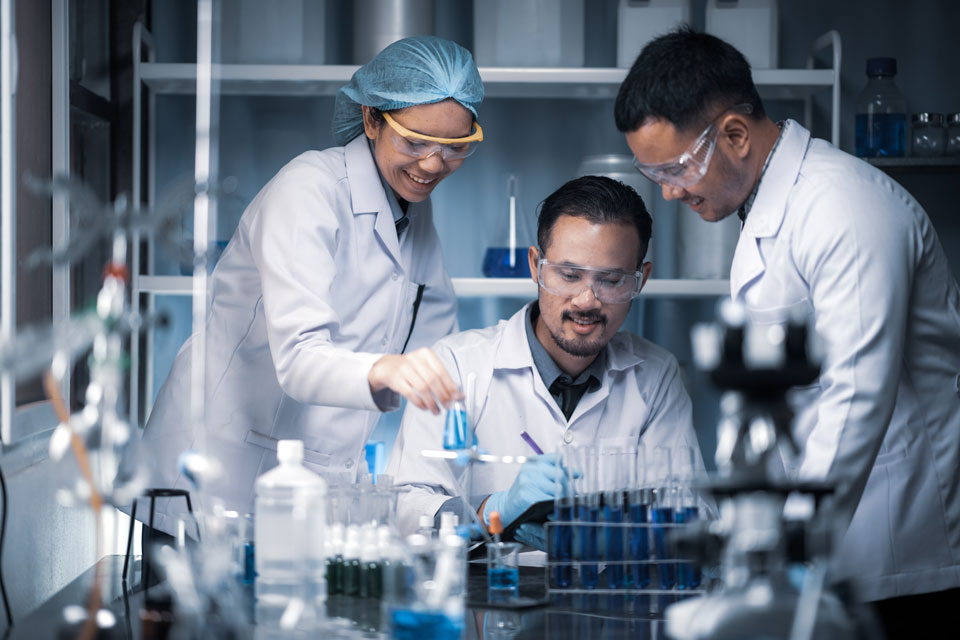 A diverse group of clinicians working in a laboratory.